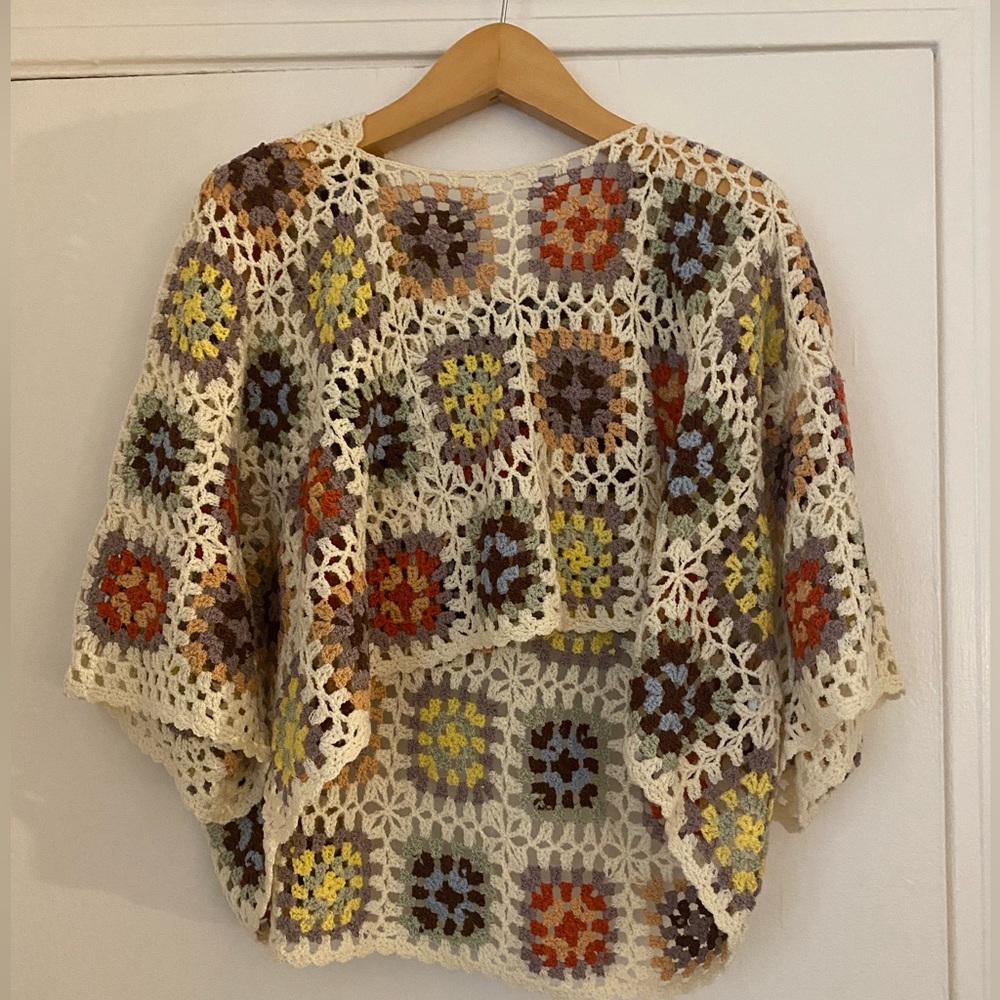 Crocheted sweater with hood